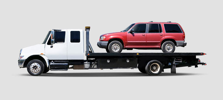 You can support BVMI by donating a vehicle you no longer need. Picture shown is of a red SUV on the back of a white flatbed tow truck.