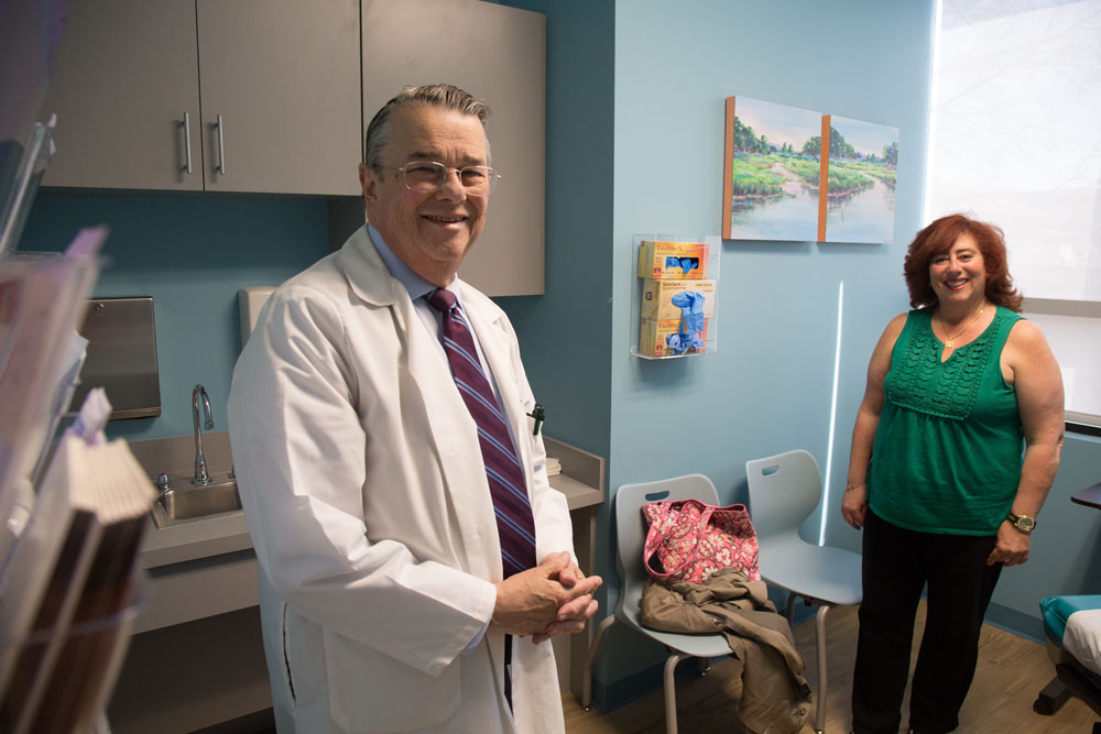 Assistant Medical Director, Dr. Lipton with a female patient in a BVMI exam room.