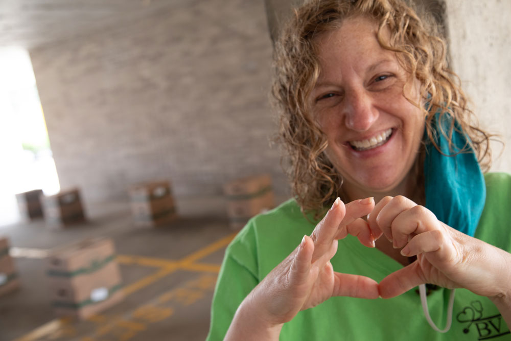 BVMI Volunteer Manager with her hands making the shape of a heart.