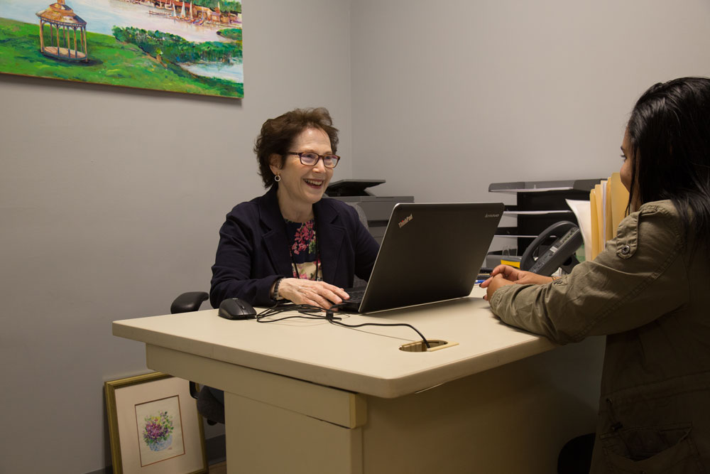 BVMI Volunteer Jane conducting a patient eligibility interview to determine if a prospective patient meets the criteria to become a BVMI patient.